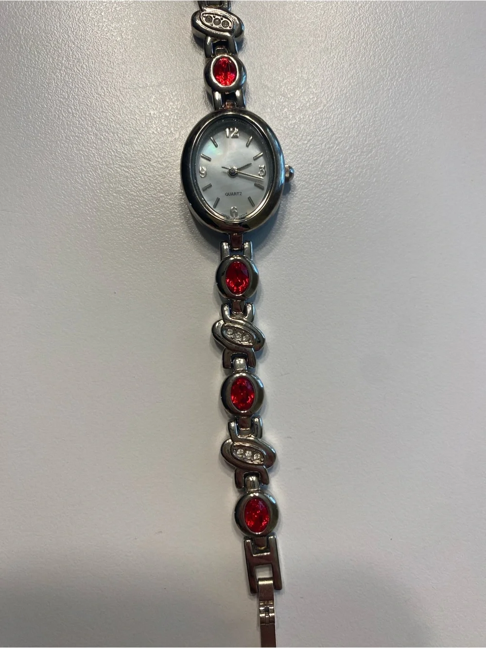 Silver Women's Bracelet Watch with Ruby Stone Accents